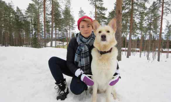 Mari Saarenpää with her dog Oiva in Paltamo, Finland. She was randomly selected to take part in the basic income experiment. Photograph: Tuomas Härkönen 